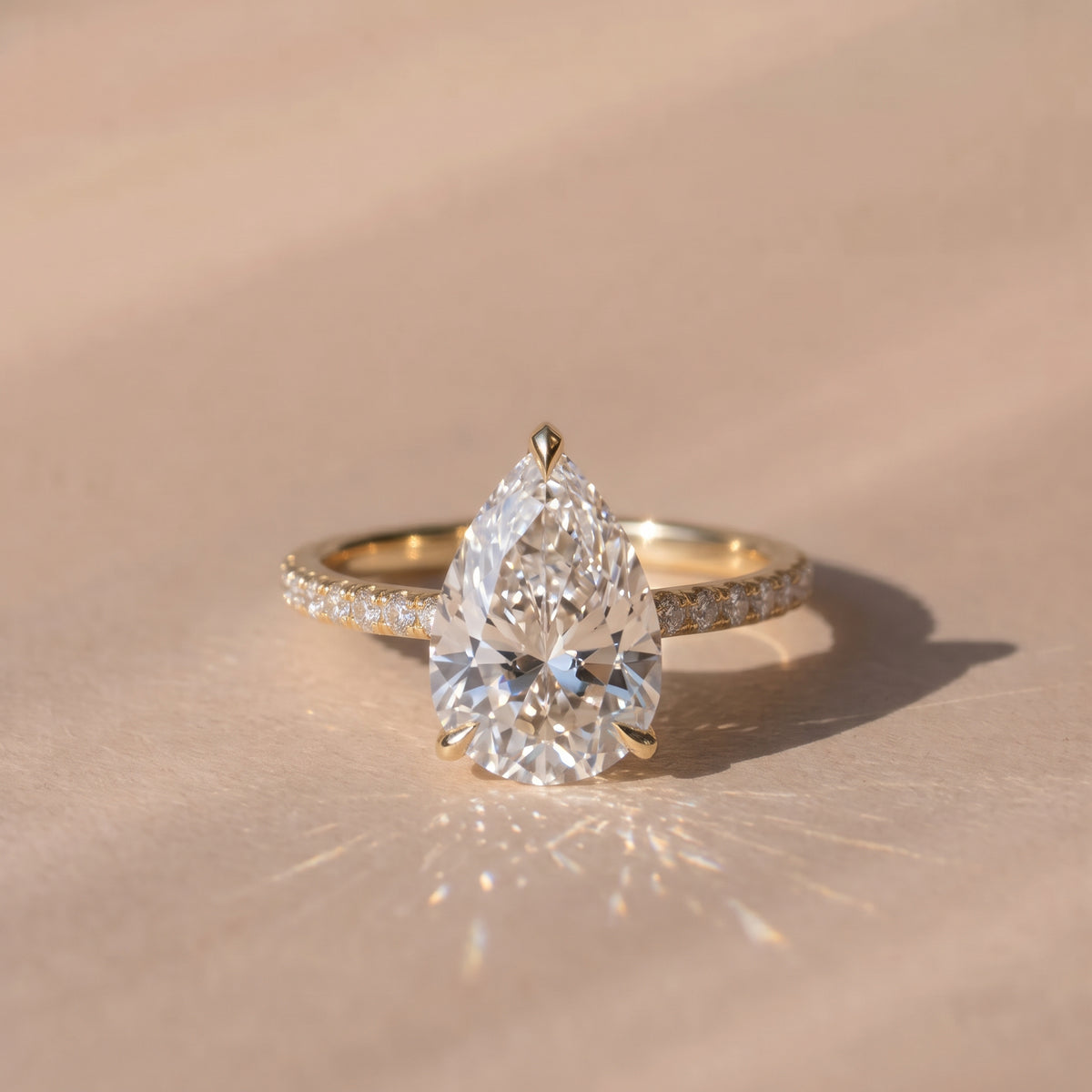 The Astra Ring — Pear Solitaire with Pavé Band Lab-Grown Diamond Engagement Ring in Yellow Gold | The Jewel Concierge