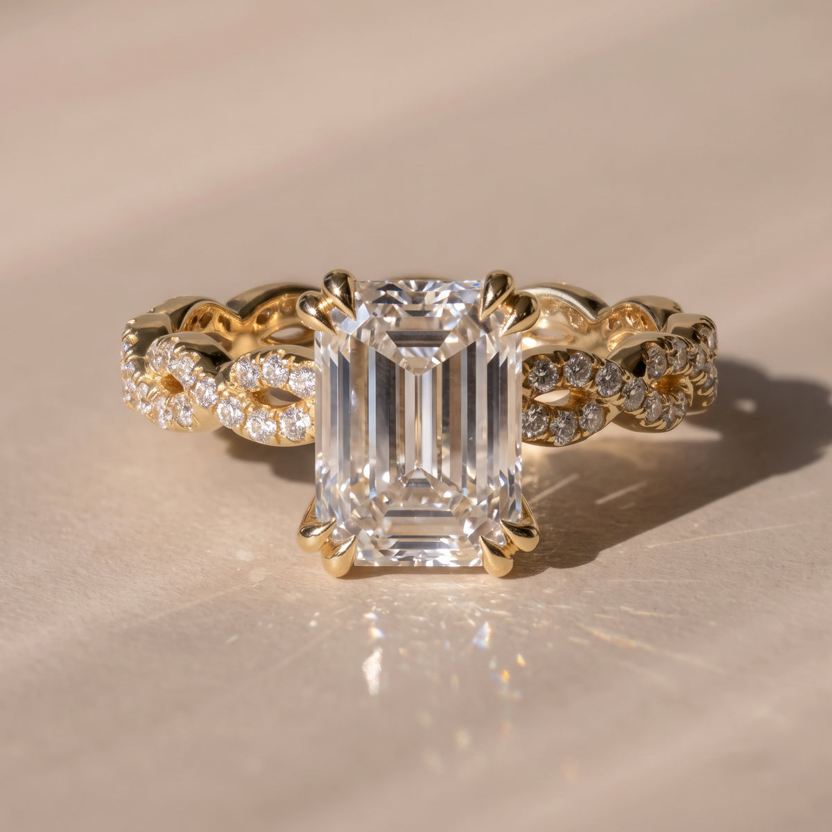 The Elysande Ring — Emerald Solitaire with Braided Pavé Band Lab-Grown Diamond Engagement Ring in Yellow Gold | The Jewel Concierge
