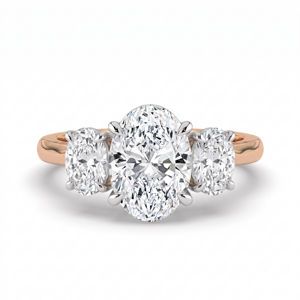 The Charlotte Ring - Oval trilogy in a two-tone rose gold & white gold setting | The Jewel Concierge