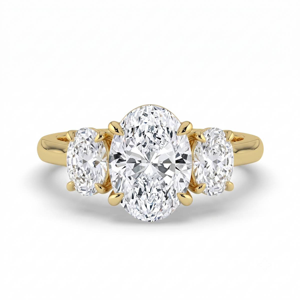 The Charlotte Ring - Oval trilogy with a yellow gold band | The Jewel Concierge