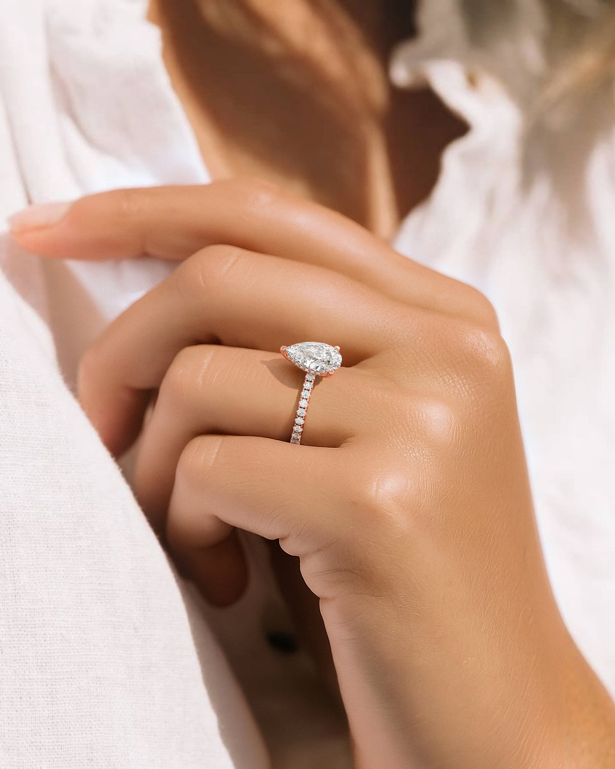 The Phoenix Ring — Pear Solitaire with Hidden Halo & Pavé Band Lab-Grown Diamond Engagement Ring in Rose Gold | The Jewel Concierge