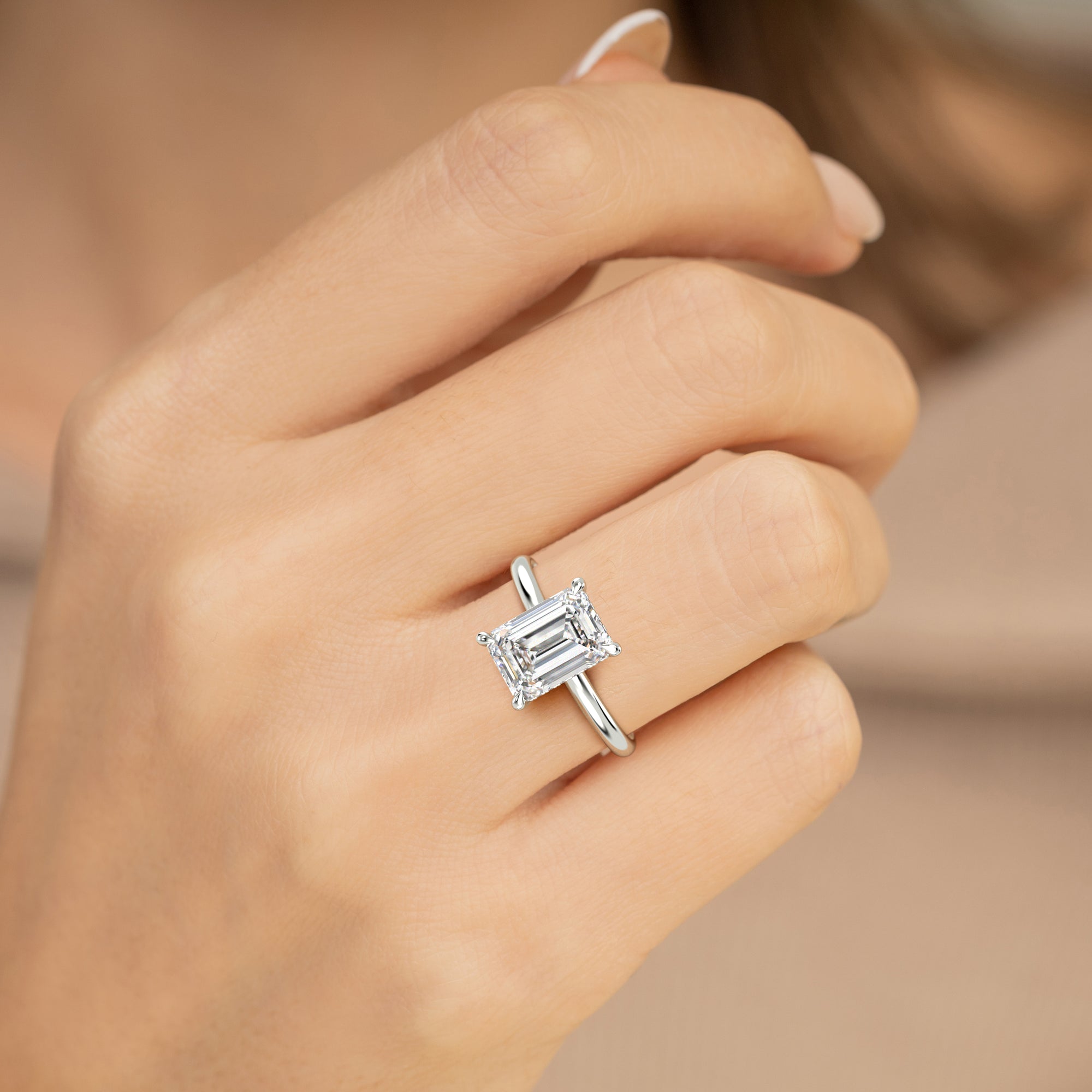 The Celeste Ring - Emerald Solitaire with Hidden Halo