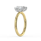 The Eloise Ring — Pear and Emerald Hidden Halo Toi Et Moi Lab-Grown Diamond Engagement Ring in Two-Tone Yellow and White Gold | The Jewel Concierge