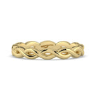 Gold braided ring on a white background