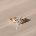 The Annalise Ring — Oval and Round Trilogy Lab-Grown Diamond Engagement Ring in Yellow Gold | The Jewel Concierge