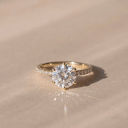 The Astra Ring — 6 Claw Round Solitaire with Pavé Band Lab-Grown Diamond Engagement Ring in Yellow Gold | The Jewel Concierge