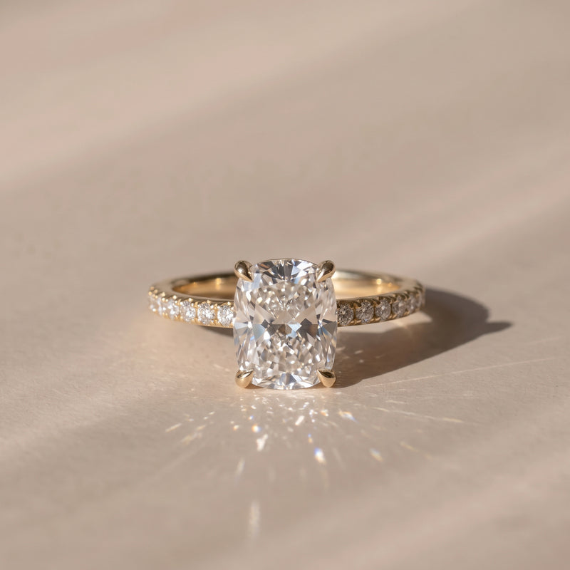 The Astra Ring — Elongated Cushion Solitaire with Pavé Band Lab-Grown Diamond Engagement Ring in Yellow Gold | The Jewel Concierge