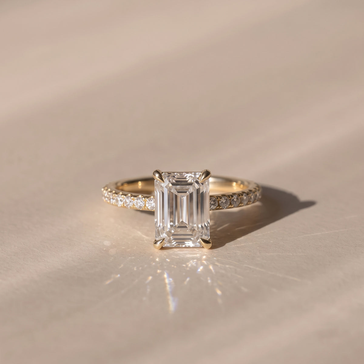 The Astra Ring — Emerald Solitaire with Pavé Band Lab-Grown Diamond Engagement Ring in Yellow Gold | The Jewel Concierge