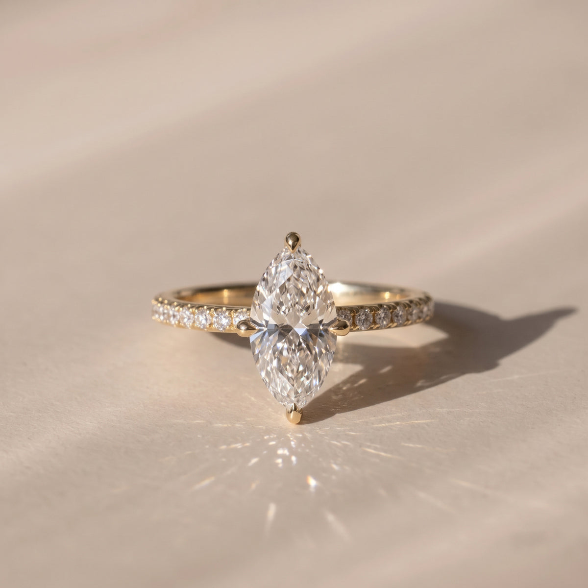 The Astra Ring — Marquise Solitaire with Pavé Band Lab-Grown Diamond Engagement Ring in Yellow Gold | The Jewel Concierge