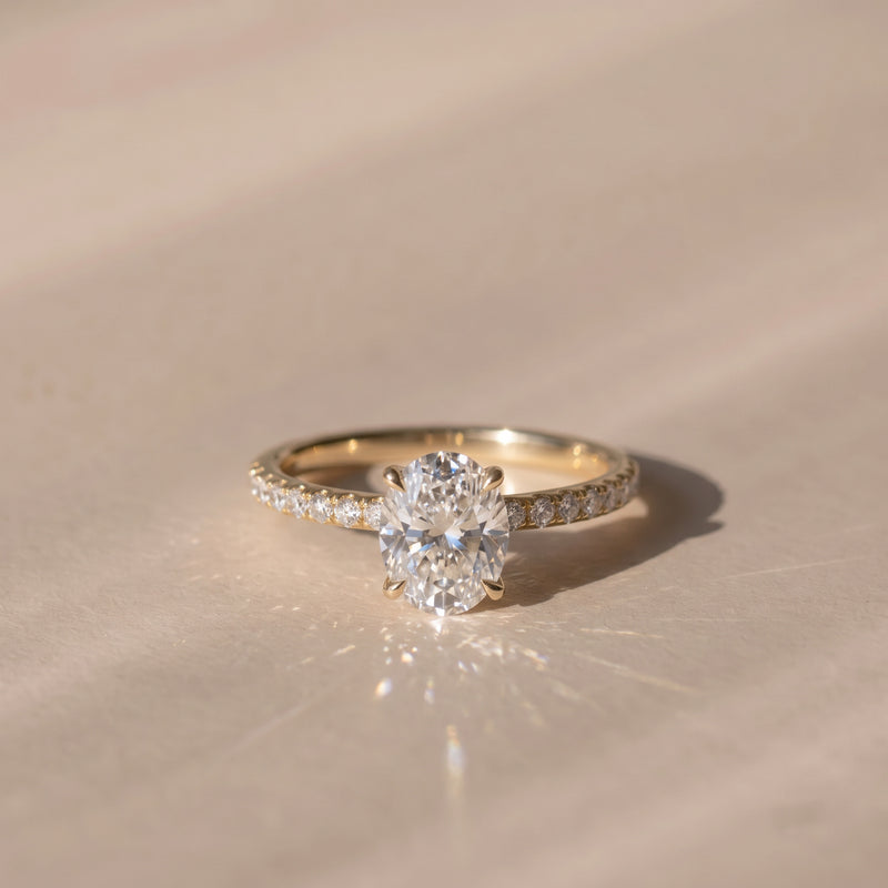 The Astra Ring — Oval Solitaire with Pavé Band Lab-Grown Diamond Engagement Ring in Yellow Gold | The Jewel Concierge