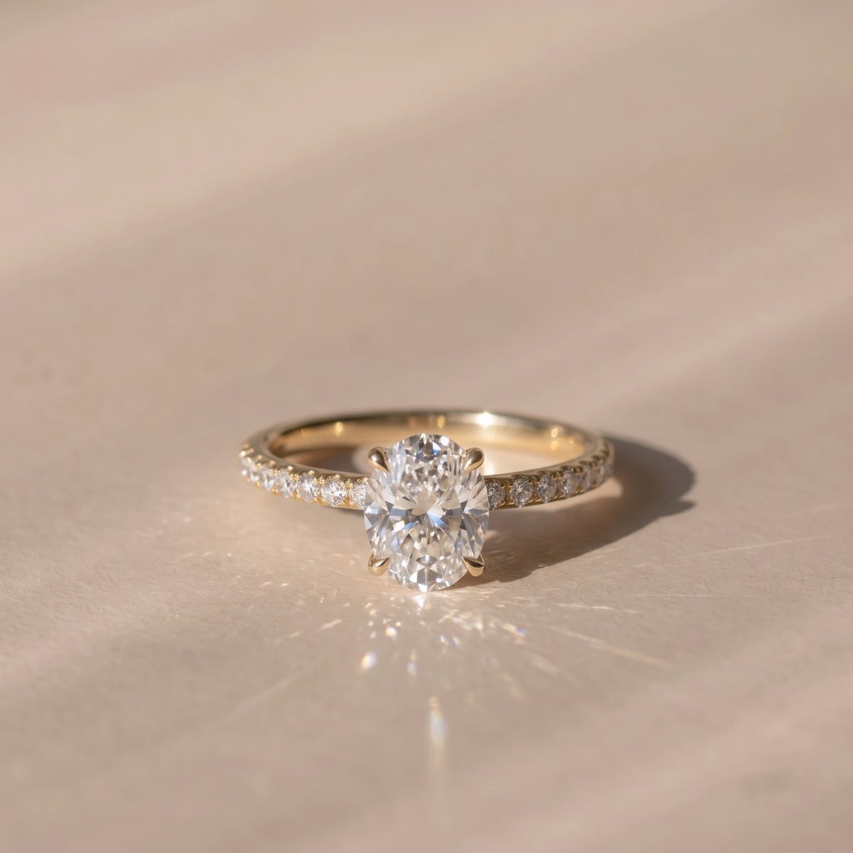 The Astra Ring — Oval Solitaire with Pavé Band Lab-Grown Diamond Engagement Ring in Yellow Gold | The Jewel Concierge