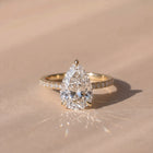 The Astra Ring — Pear Solitaire with Pavé Band Lab-Grown Diamond Engagement Ring in Yellow Gold | The Jewel Concierge
