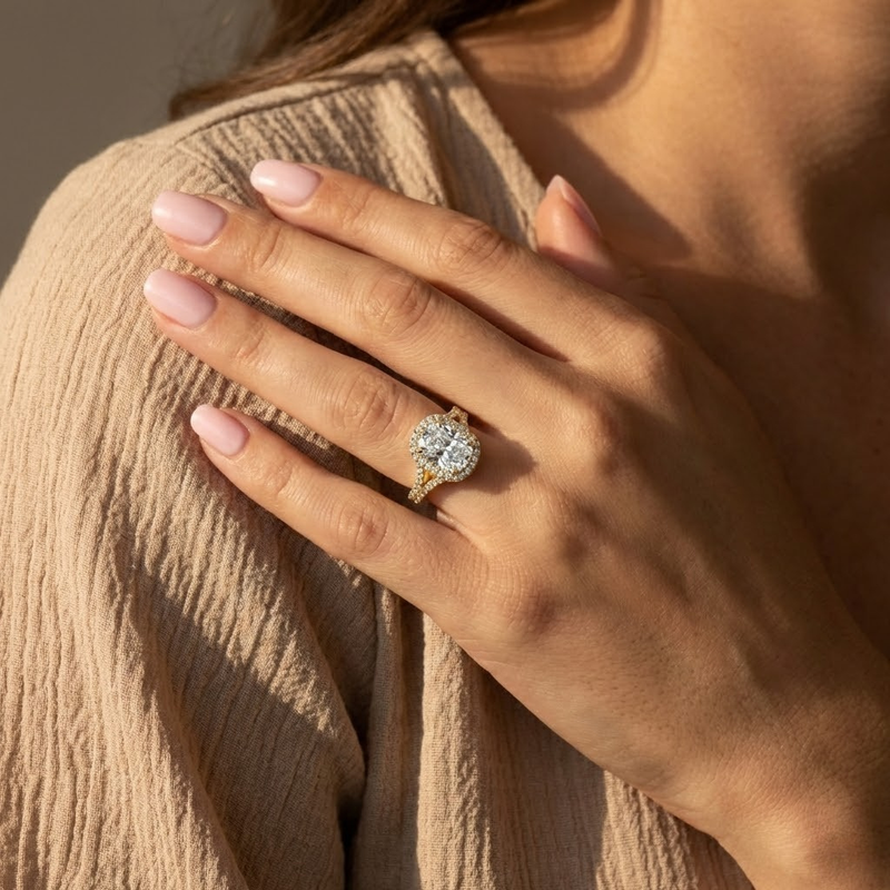 Elara Ring — elongated cushion lab grown diamond orbital halo with split pavé band engagement ring in yellow gold — The Jewel Concierge