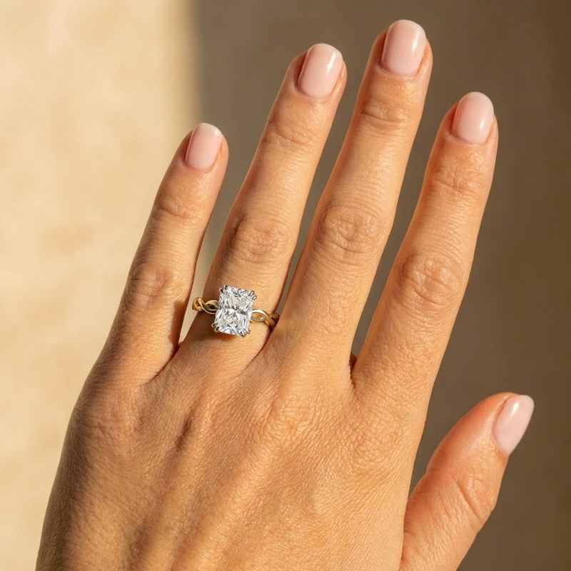 The Elysande Ring – Radiant Solitaire with Braided Band in 14K White Gold – The Jewel Concierge