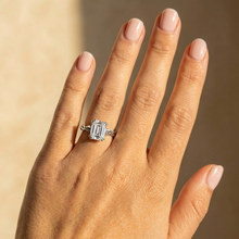 The Elysande Ring – Emerald Solitaire with Braided Band in 14K White Gold – The Jewel Concierge