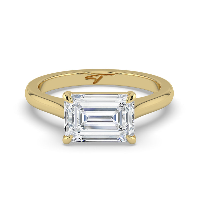 The Aria Ring – East-West Emerald Solitaire in 14K Yellow Gold – The Jewel Concierge