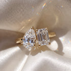The Melodie Ring — Pear and Emerald Hidden Halo Toi Et Moi Lab-Grown Diamond Engagement Ring in Yellow Gold | The Jewel Concierge