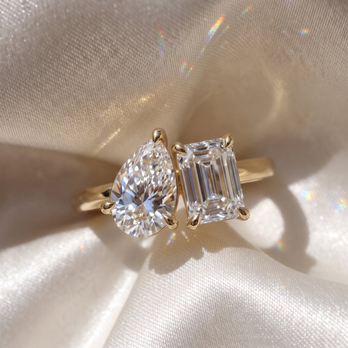 The Melodie Ring — Pear and Emerald Hidden Halo Toi Et Moi Lab-Grown Diamond Engagement Ring in Yellow Gold | The Jewel Concierge