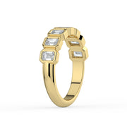 The Sara Ring — Emerald Bezel Set Half Lab-Grown Diamond Eternity Band in Yellow Gold | The Jewel Concierge