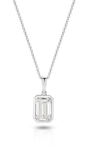 A yellow gold pendant featuring an emerald lab-grown diamond, set in a bezel setting against a clean white background with a soft reflection - The Jewel Concierge