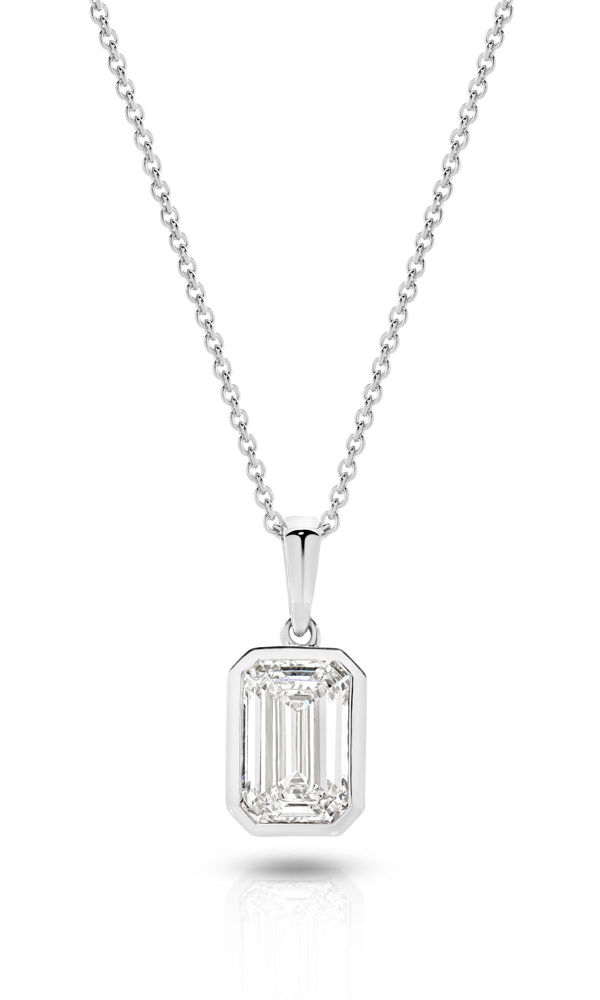 A yellow gold pendant featuring an emerald lab-grown diamond, set in a bezel setting against a clean white background with a soft reflection - The Jewel Concierge