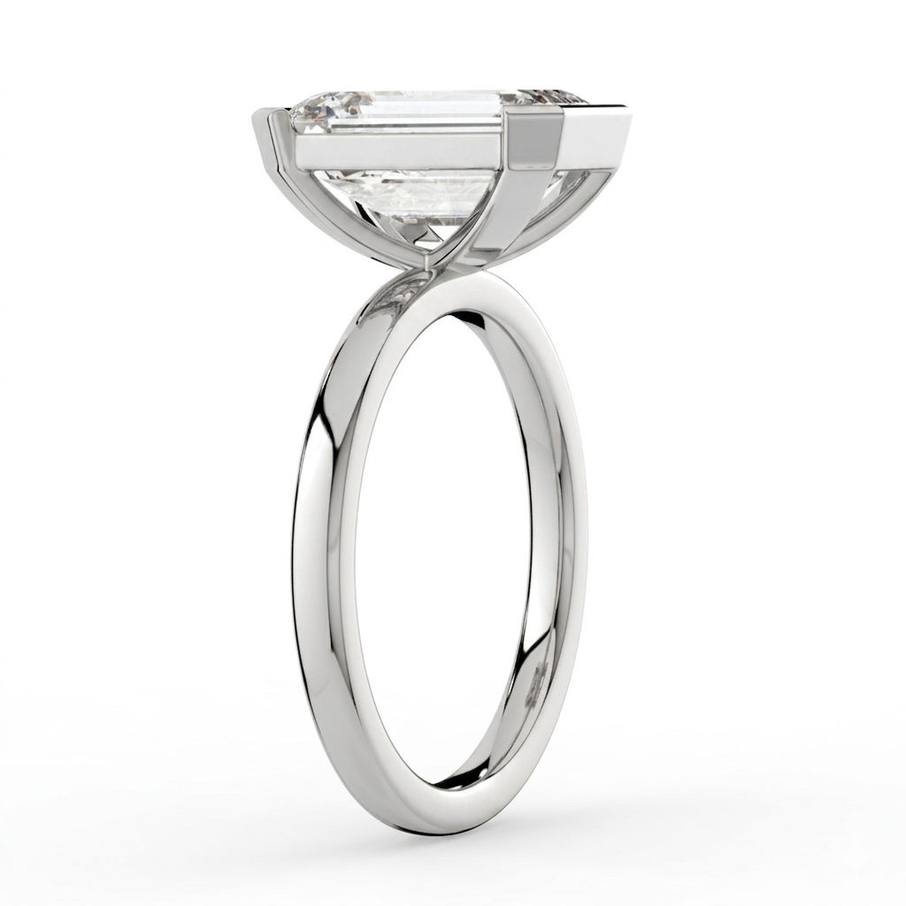 The Celine Ring – Emerald Half Bezel Solitaire in 18K White Gold – The Jewel Concierge