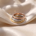 The Emily Ring - plain 3mm half rounded wedding band, laid elegantly on a luxurious silk fabric | The Jewel Concierge
