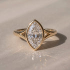 The Gabriella Ring — Marquise Bezel with Split Band Lab-Grown Diamond Engagement Ring in Yellow Gold | The Jewel Concierge