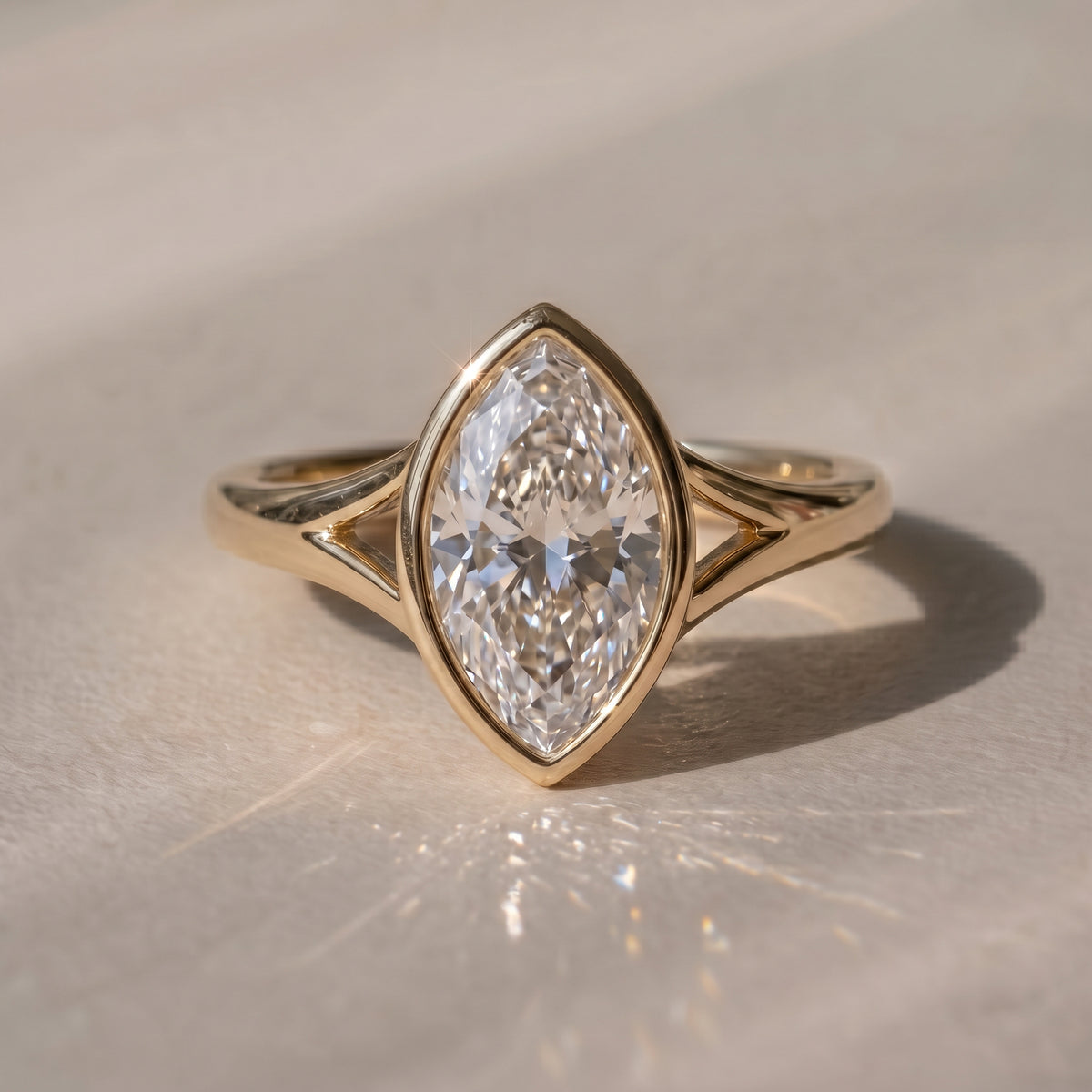 The Gabriella Ring — Marquise Bezel with Split Band Lab-Grown Diamond Engagement Ring in Yellow Gold | The Jewel Concierge