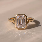 The Gabriella Ring — Emerald Bezel with Split Band Lab-Grown Diamond Engagement Ring in Yellow Gold | The Jewel Concierge