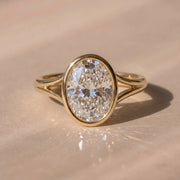 The Gabriella Ring — Oval Bezel with Split Band Lab-Grown Diamond Engagement Ring in Yellow Gold | The Jewel Concierge