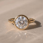 The Gabriella Ring — Round Bezel with Split Band Lab-Grown Diamond Engagement Ring in Yellow Gold | The Jewel Concierge