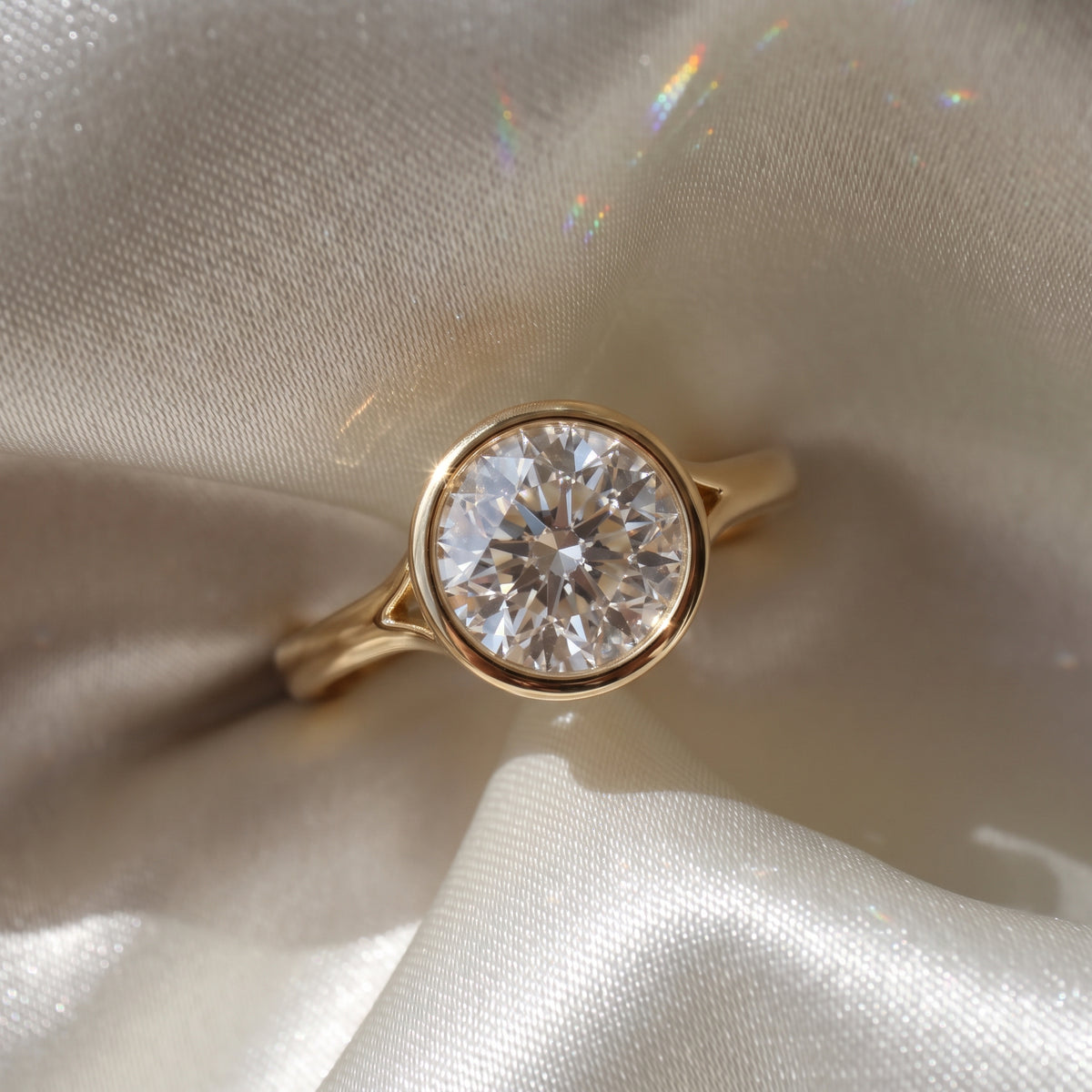 The Gabriella Ring — Round Bezel with Split Band Lab-Grown Diamond Engagement Ring in Yellow Gold | The Jewel Concierge