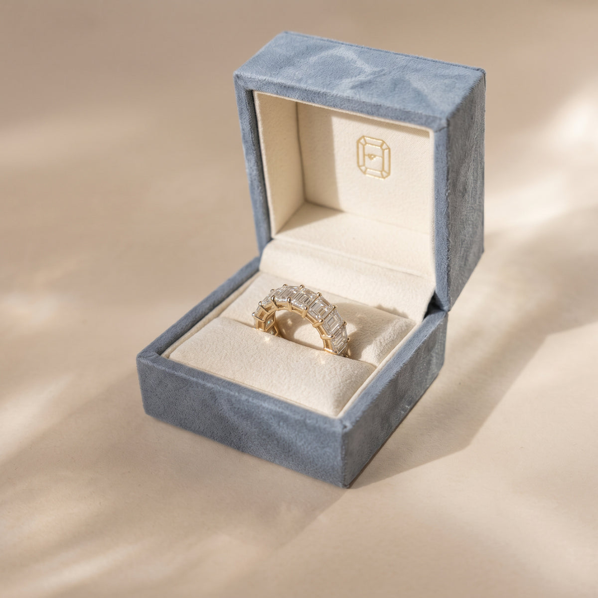 The Genevieve Ring - Emerald eternity ring in our signtaure ring box | The Jewel Concierge
