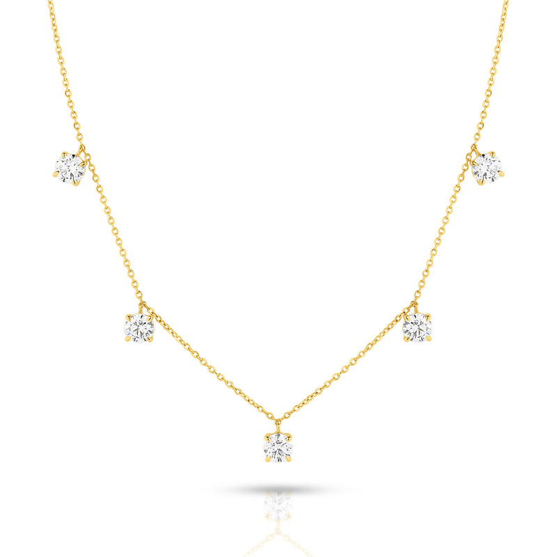 A delicate yellow gold necklace featuring five round-cut lab-grown diamonds spaced along the chain, set against a plain white background - The Jewel Concierge