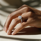 Round cut lab grown diamond engagement ring in 18K WG, set in a halo of pave diamonds and finished with a 3/4 pave band - The Jewel Concierge
