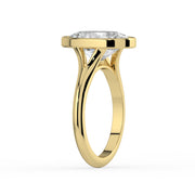 The Gabriella Ring — Oval Bezel with Split Band Lab-Grown Diamond Engagement Ring in Yellow Gold | The Jewel Concierge