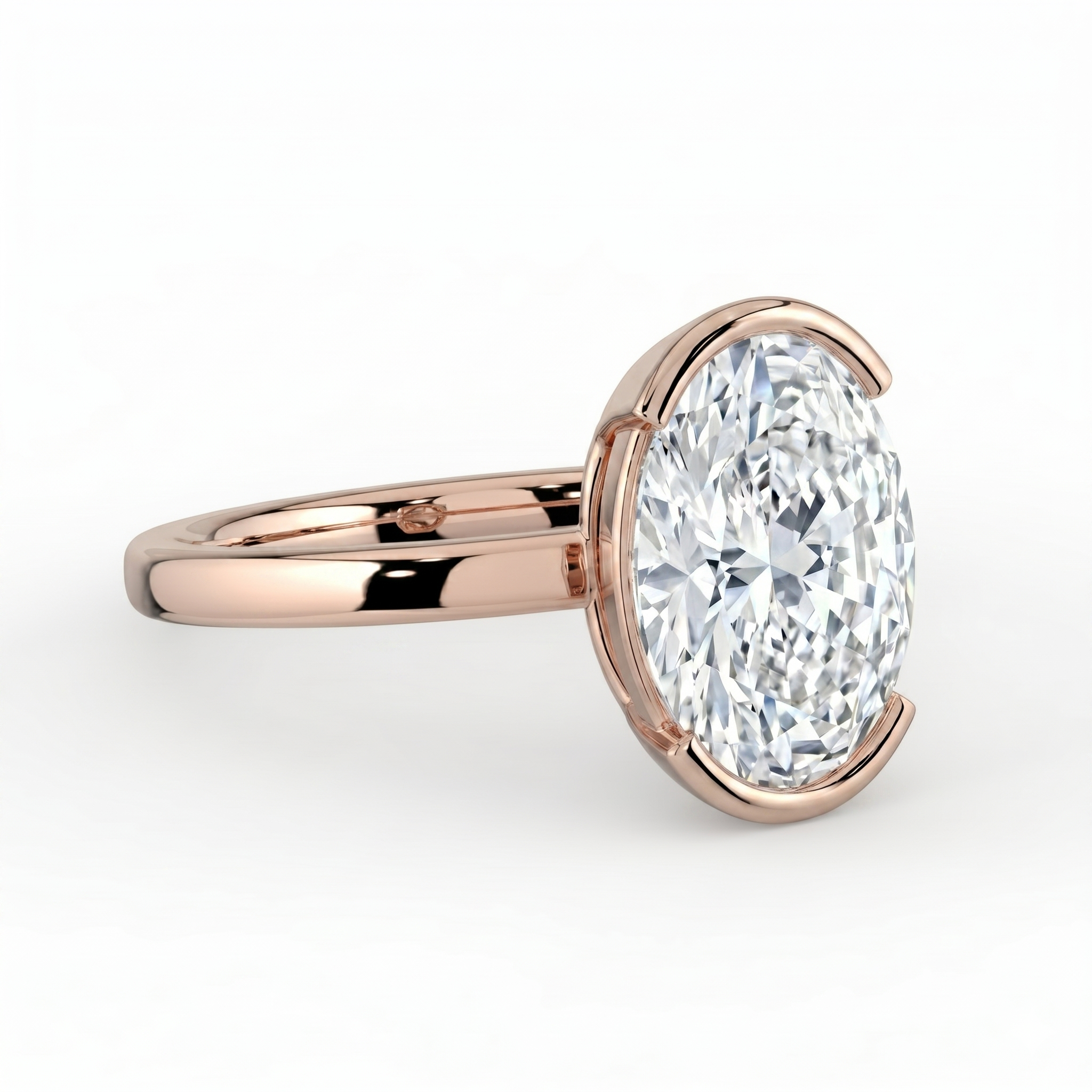The Celine Ring – Oval Half Bezel Solitaire in 18K Rose Gold – The Jewel Concierge