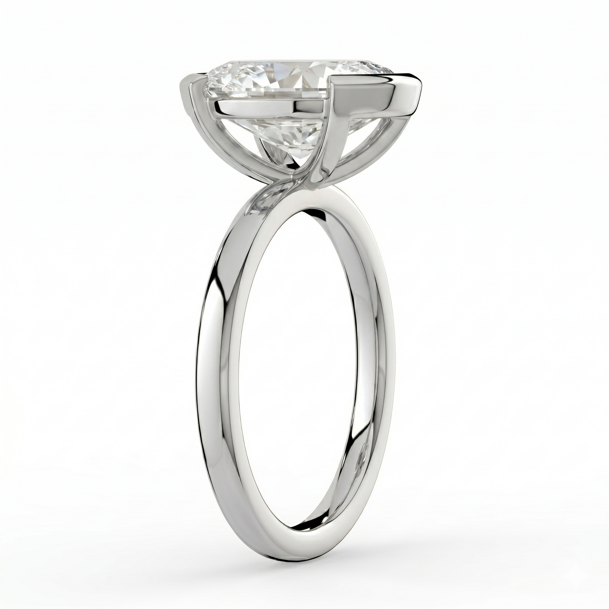 The Celine Ring – Oval Half Bezel Solitaire in 18K White Gold – The Jewel Concierge