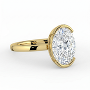 The Celine Ring — Oval Half Bezel Solitaire Lab-Grown Diamond Engagement Ring in Yellow Gold | The Jewel Concierge
