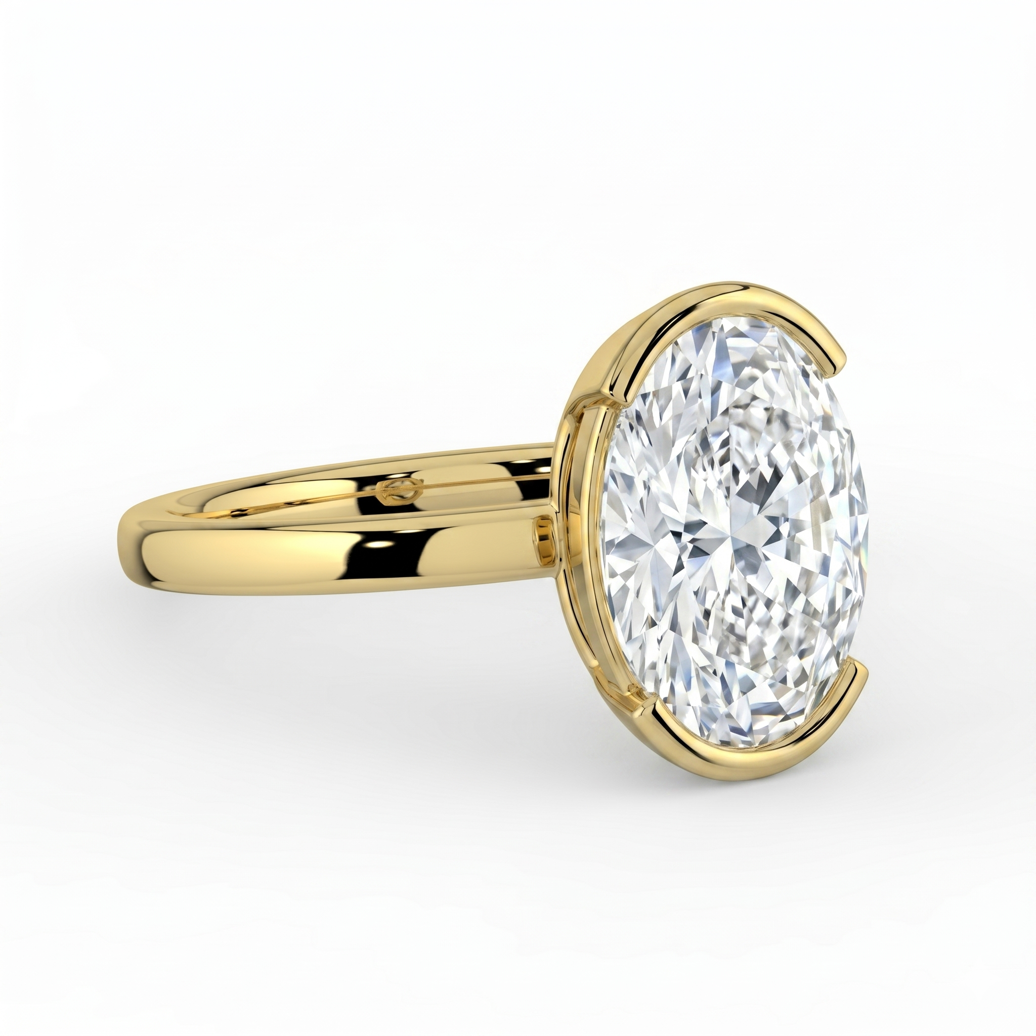 The Celine Ring – Oval Half Bezel Solitaire in 18K Yellow Gold – The Jewel Concierge