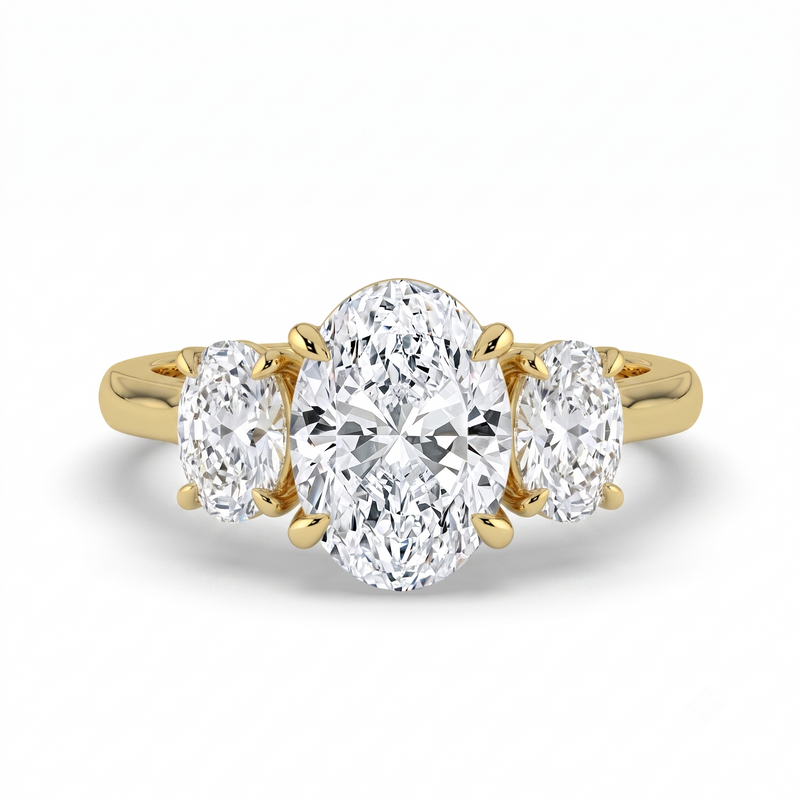 The Charlotte Ring - Oval trilogy with a yellow gold band | The Jewel Concierge