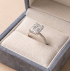 The Phoenix Ring — Emerald Solitaire with Hidden Halo & Pavé Band Lab-Grown Diamond Engagement Ring in White Gold | The Jewel Concierge