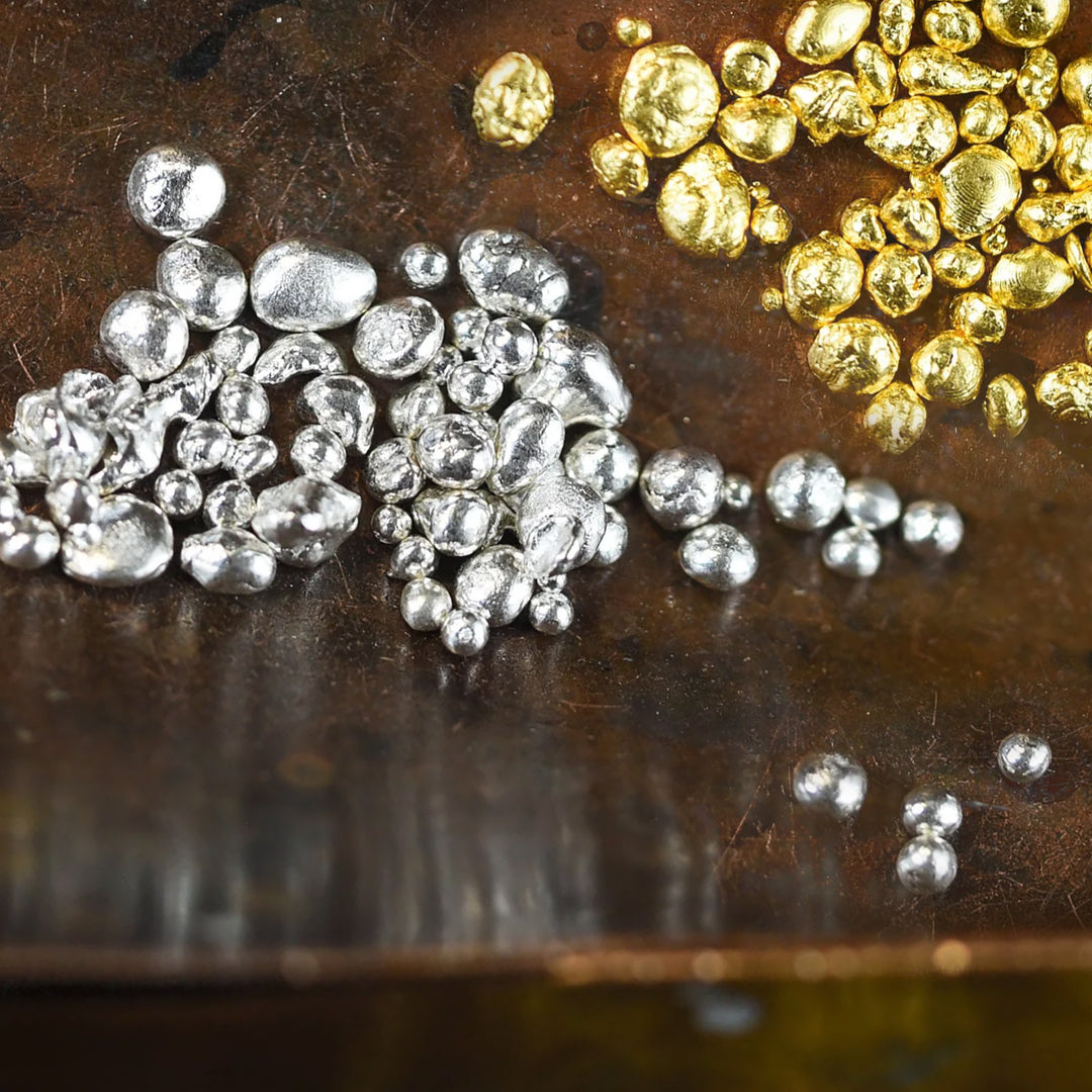 gold nuggets on a wooden trend