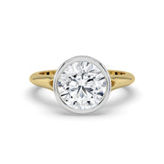 The Gabriella Ring — Round Bezel with Split Band Lab-Grown Diamond Engagement Ring in Two-Tone Yellow and White Gold | The Jewel Concierge