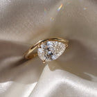 The Solis Ring — Curved East West Pear Cut on a luxurious silk fabric | The Jewel Concierge