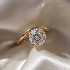The Solis Ring — Curved East West Round Cut on a luxurious silk fabric | The Jewel Concierge