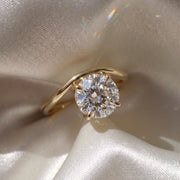 The Solis Ring — Curved East West Round Cut on a luxurious silk fabric | The Jewel Concierge
