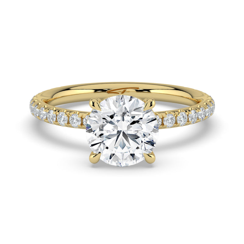 The Astra Ring – 4 Claw Round Solitaire with Pavé Band in 14K Yellow Gold – The Jewel Concierge