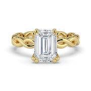 The Elysande Ring – Emerald Solitaire with Braided Band in 14K Yellow Gold – The Jewel Concierge